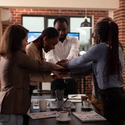 excited successful multi ethnic businesspeople celebrating marketing partnership